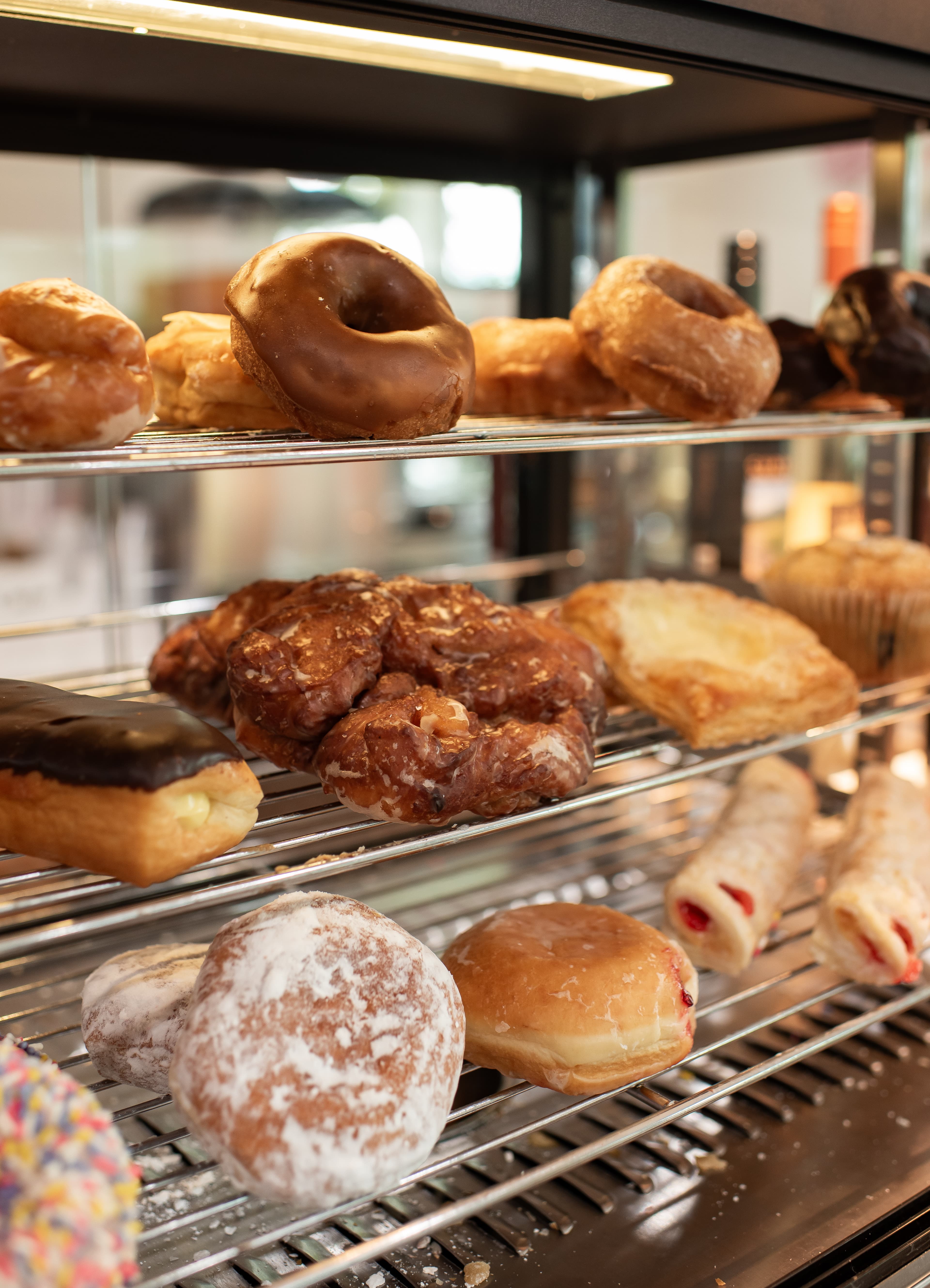 Fresh donut and pastry display case at Amelia's Cafe Hiawassee Georgia