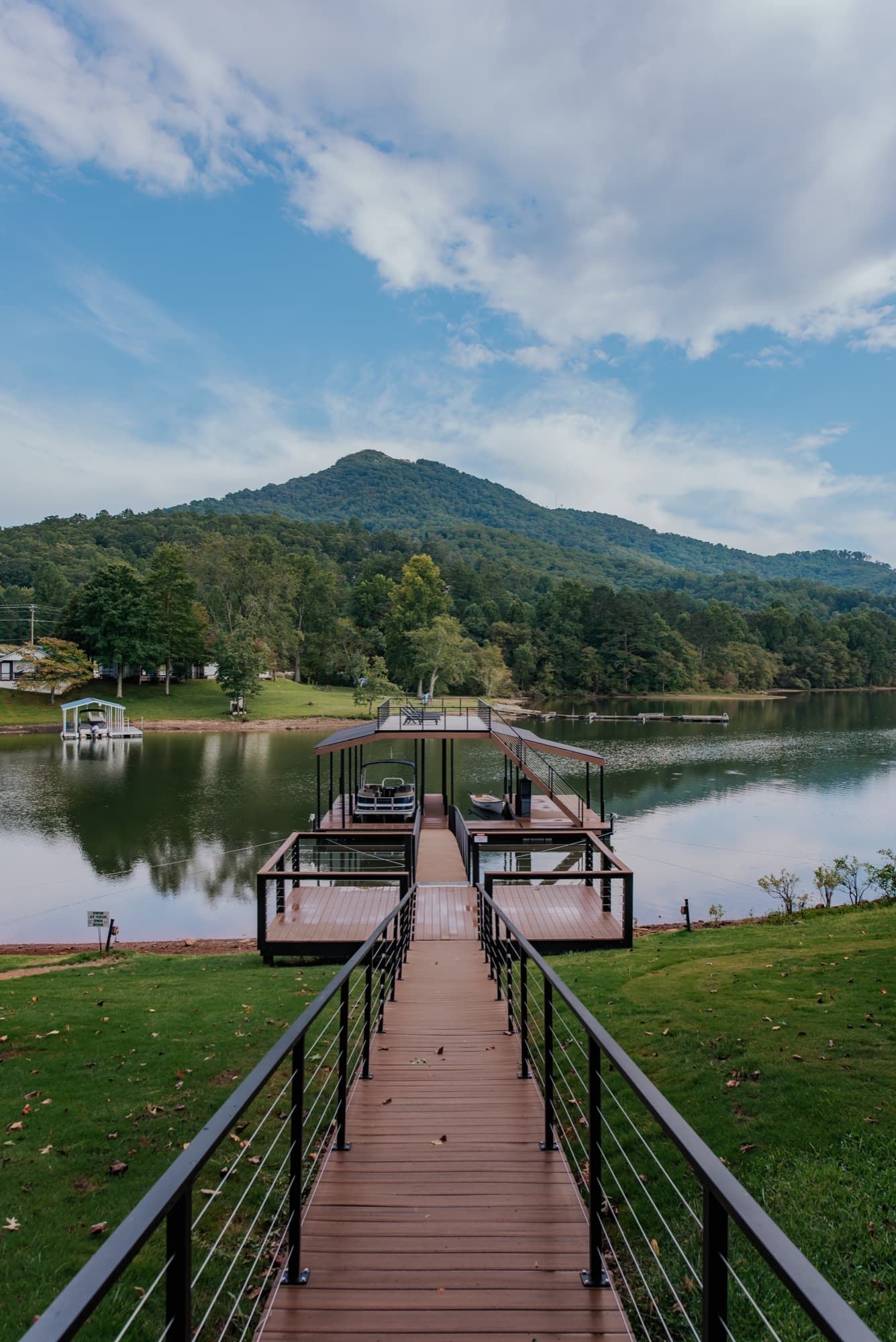 Dock walkway with mountain views at Tranquille Resort